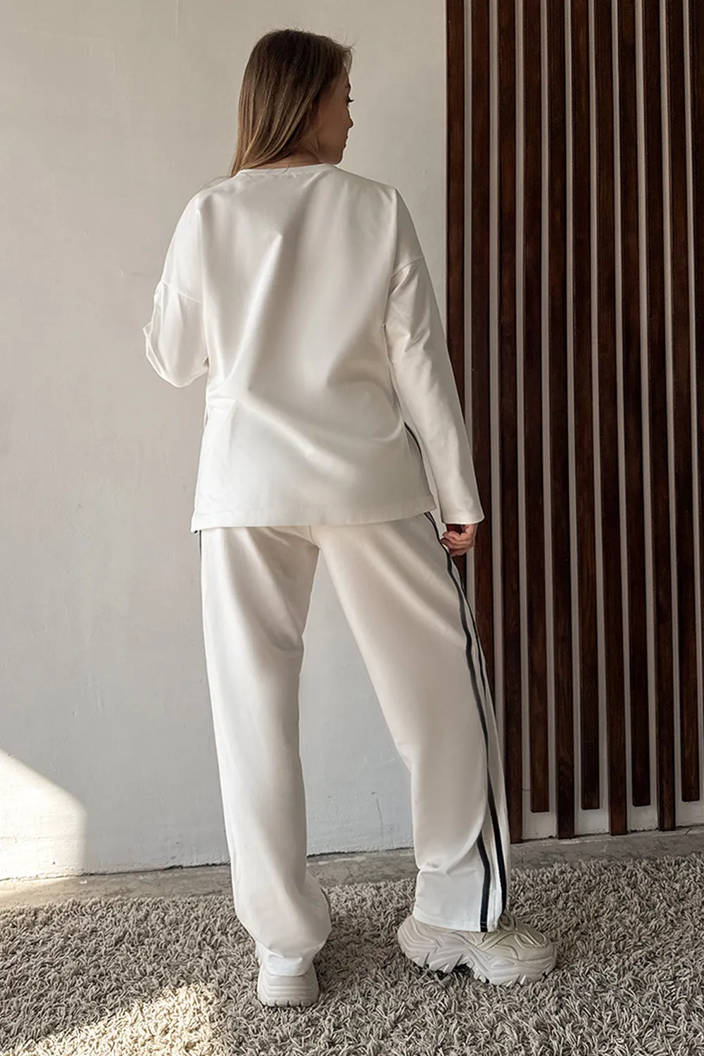 Milk suit with contrasting stripes
