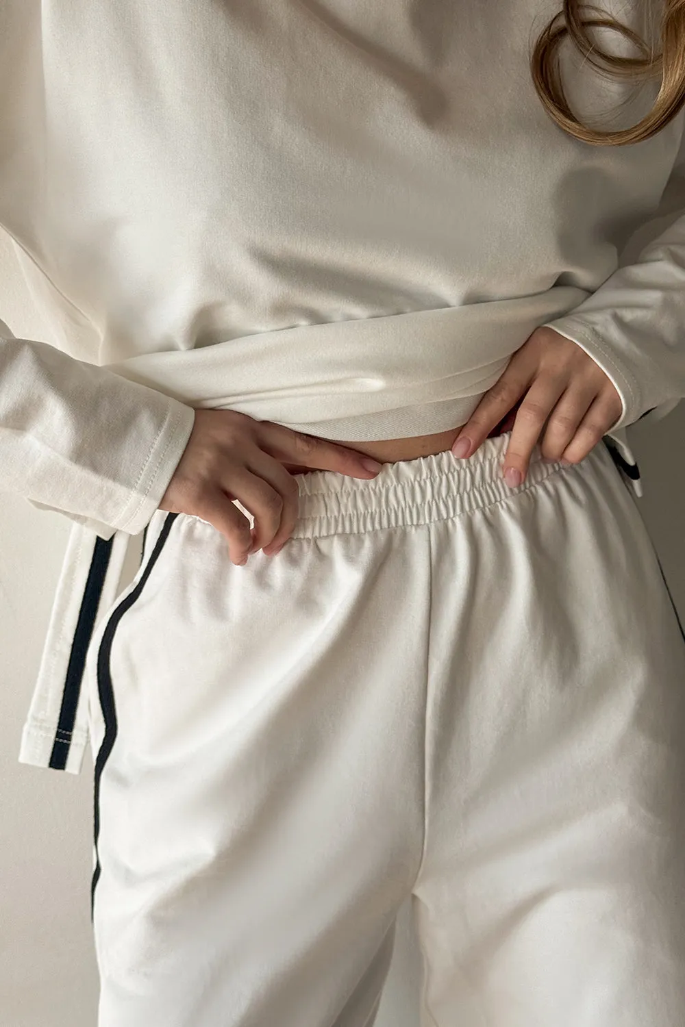Milk suit with contrasting stripes