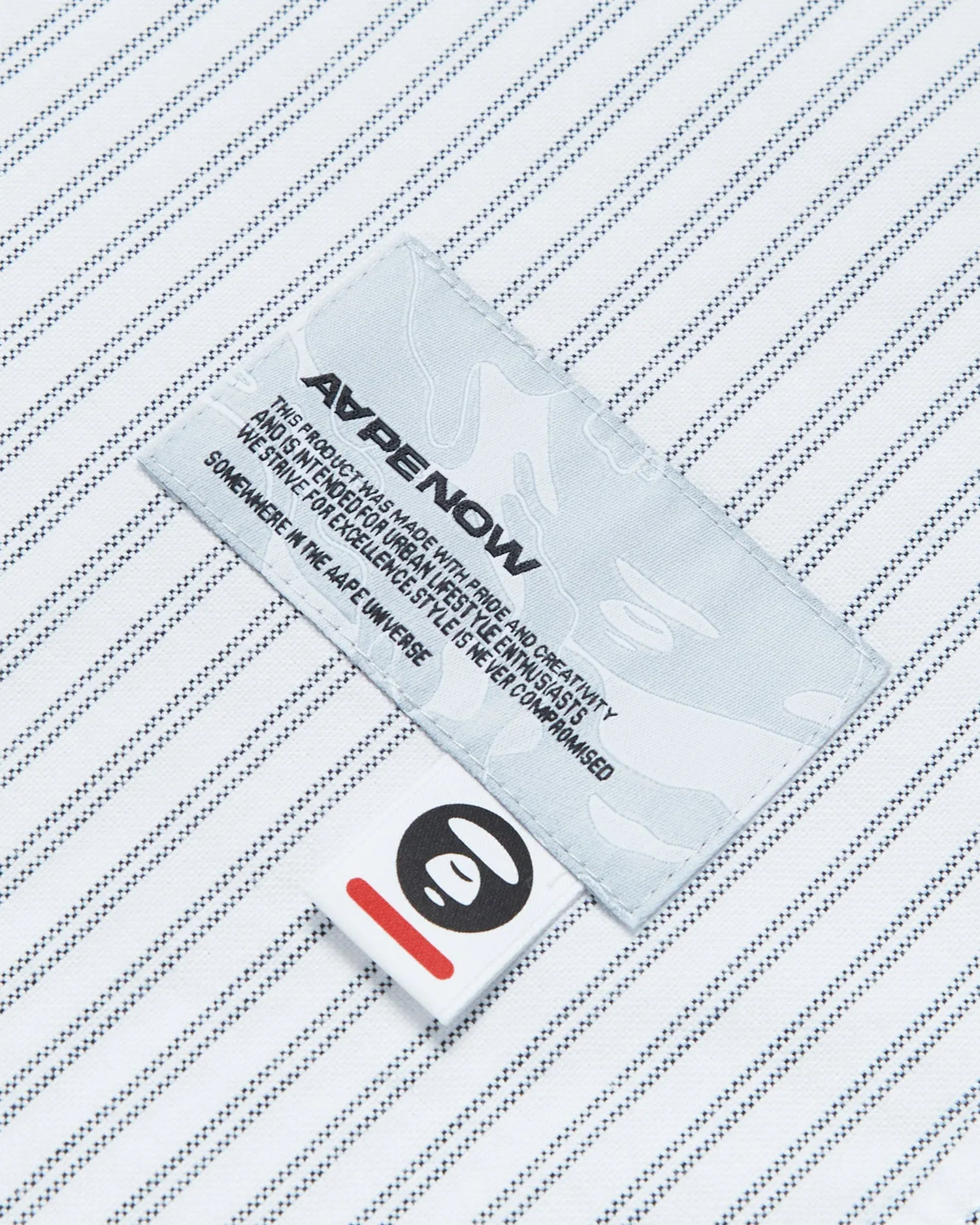 Moonface patch striped shirt